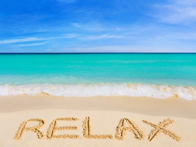 Word Relax on beach - vacation concept background